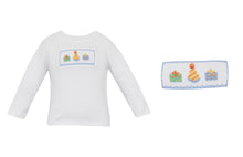 Load image into Gallery viewer, Celebrate your little one’s special day in style with the Boy's Birthday Smocked Long Sleeve T-Shirt by Petit Bebe. This charming t-shirt is adorned with a delicate smocking and embroidered birthday hats and gifts detail. Ideal for making your infant boy's birthday truly unforgettable! Pairs with the Blue Gingham Pants for a pulled together birthday look!