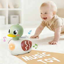 Load image into Gallery viewer, Sing & Spin Quack is an Educational Singing Duck Toy- Spark baby's curiosity and cognitive development with 2-in-1 educational music toy! Features a "Learning Mode" plays fun, catchy songs to teach ABCs and 123s, and a "Music Mode" with a variety of engaging melodies. Dual-mode design is perfectly tailored to support early auditory and brain development for infants 6 months and up. Requires 3 x AAA batteries, batteries not included.