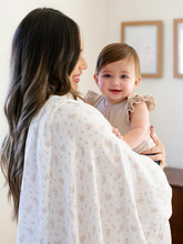 Load image into Gallery viewer, The Swaddle Blanket Set from JuJuBe × Studio Oh! includes two blankets, each with an irresistible, on-trend design. While perfect for swaddling newborns, these blankets can also be used for tummy time, as lightweight stroller covers, and as nursing throws. Each measures 44 by 44 inches (112 cm × 112 cm) and is made of sustainable, non-GMO bamboo fabric that is gentle on Baby’s skin and is soft, cozy, and breathable. Designed with sweet artwork in nursery-friendly colors, these blankets come packaged in a gi