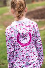 Load image into Gallery viewer, PRODOH Girl's Pro Performance Hoodie T-shirt in Pink Break Point Camo  isn't just any hoodie—it's her go-to gear for all things outdoors. From fishing trips with Dad to beach walks with the fam, our Girls' Pink Camo Performance Hoodie is built for big fun and serious sun protection. The lightweight fabric keeps her cool and dry (even after catching frogs or chasing waves), while the UPF 50+ rating gives you peace of mind under the sun