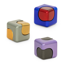 Load image into Gallery viewer, The Spin Cube is a satisfying sensory fidget toy designed for endless spinning fun. Featuring smooth, continuous rotation, itβs perfect for keeping hands busy, relieving stress, and improving focus at home, school, or on the go. Compact and engaging, the Spin Cube offers simple, tactile play that appeals to both kids and adults, making it an ideal desk companion, pocket fidget, or gift.