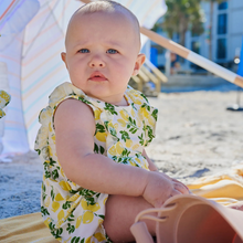 Load image into Gallery viewer, Simply the Zest Lemon Romper brings effortless style and function together. This cheerful lemon-print bubble romper from Magnetic Me features strategically placed magnets at the back and bottom, transforming diaper changes and quick outfit swaps into a breeze. Crafted from luxuriously soft modal fabric, it offers generous room for active movement without sacrificing elegance. 