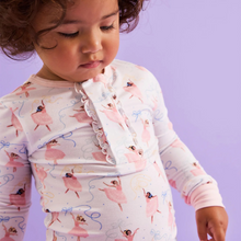 Load image into Gallery viewer, The Pretty Plies Pajama Set from Magnetic Me combines charming ballerina-themed design with effortless comfort. Featuring a magnetic front top detailed with delicate ruffles and coordinating pants, this set is crafted from soft, stretchy modal fabric that moves with your child. Perfect for bedtime or lounging, these pajamas offer cozy wear and easy dressing, making nighttime routines smooth and enjoyable. Embrace comfort and style in one delightful set.