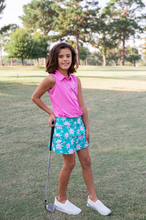 Load image into Gallery viewer, Elevate your little girl's summer sports wardrobe with the Girls Sleeveless Pro Performance Polo Shirt in Fuchsia Pink from Prodoh. This collared top is perfect for activities like golf and tennis, providing unbeatable comfort and style. Pair it with the Carolina Catch Skort for the ultimate athleisure look.