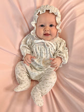 Load image into Gallery viewer, Dress your little one in the Bella Pink Floral Hand Smocked Bishop Footie by Baby Loren, crafted from soft pima cotton for gentle comfort. Its delicate bishop smocked neckline and elegant floral embroidery add timeless charm, making it perfect for special occasions or everyday wear. This beautifully detailed footie ensures your infant girl stays cozy while looking effortlessly adorable.
