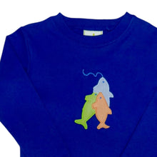 Load image into Gallery viewer, Dress your little adventurer in the Boys Fishing Lure Harry Play Tee & Pant Set, perfectly designed for comfort and style. The navy long sleeve tee showcases a playful fishing lure applique, sparking imagination and fun. Coordinating orange and white gingham pants add a vibrant touch, making the outfit perfect for active play or casual outings. For the tiniest anglers, a matching infant longall is also available, completing a charming set for your whole family.