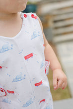 Load image into Gallery viewer, This charming Infant Boy's Puppy Dog Tails Reed Jon Jon from James & Lottie features an irresistible blue, white, and red puppy and wagon print that will captivate everyone's attention. Crafted from comfortable knit fabric, this adorable outfit is perfect for your little puppy enthusiast. Make summer memories even more special with this eye-catching Jon Jon that combines playful style with classic appeal. A must-have addition to your little one's wardrobe!
