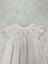 Load image into Gallery viewer, Timeless elegance is this charming Pink Tiny Dots Hand Smock Pima Bishop Bubble from Baby Loren. Crafted from premium Pima cotton, this delicate bubble features a crisp white base adorned with dainty pink dots that add a touch of whimsy. The signature bishop smocked neckline showcases meticulous hand-smocking detail.