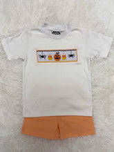 Load image into Gallery viewer, Celebrate fall in style with the Spooky Season Smocked Short Set from Cape Point Clothing. This charming outfit pairs a crisp white tee featuring a playful smocked "Spooky" design with coordinating orange and white gingham shorts. Perfect for your little one’s autumn adventures, this set combines comfort with festive flair, making it ideal for seasonal celebrations and everyday wear. Embrace the spirit of the season with a look that’s both cute and cozy.