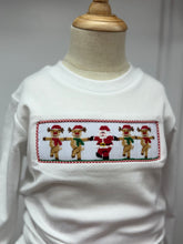Load image into Gallery viewer, Get your little boy holiday-ready with the Boys Rockin' Reindeer Pant Set. Its red and white gingham fabric pants and coordinating white tee is accented by charming smocked reindeer and Santa embroidery, creating a festive and classic look. Designed for comfort and style, it’s perfect for holiday gatherings and pairs beautifully with matching sibling outfits to create memorable family moments.
