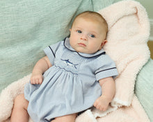 Load image into Gallery viewer, Get ready for a summer of adventure with our Boy's Sailfish Bubble from Cape Point Clothing Co.! This elegant and classic outfit features a checked navy and white design with smocked fish detail and a charming peter pan collar. Perfect for any little gentleman, this bubble is sure to make a splash while keeping your little one looking stylish.