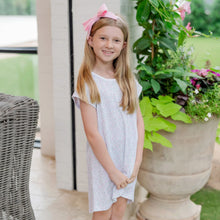 Load image into Gallery viewer, Introducing the Sadie Girls’ Dress in Garden Soiree by Lila + Hayes! This charming cap sleeve dress, made from luxurious Pima cotton, showcases a vibrant garden floral print that whispers of spring and summer adventures. Its comfortable design hits above the knees, ensuring your little one feels free to explore in style!