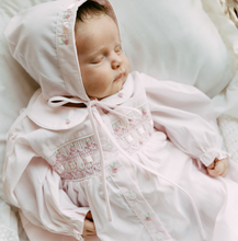 Load image into Gallery viewer, Welcome your little one in style with the Pink Ribbon Smocked Take Me Home Gown With Bonnet by Feltman Brothers. This timeless gown, adorned with classic smocking and charming buttons, creates a perfect backdrop for precious newborn photos. The included bonnet completes this adorable look, ensuring your baby shines on their journey home!