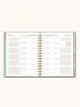 Load image into Gallery viewer, With so much to think about during pregnancy, the Undated Pregnancy Planner & Journal from Studio Oh! is the ideal companion for navigating the unique experiences and responsibilities of this special time as well as keeping expectant moms organized. Inside, you’ll find monthly and weekly views for staying organized through all three trimesters, plus additional monthly views to keep new moms on track after birth.