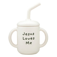 Load image into Gallery viewer, This darling silicone sippy cup with a straw is the perfect tumbler for keeping baby hydrated at home or on the go. A sweet daily reminder of Jesus' love!
- Made of BPA-free, food-safe silicone for safe sipping
- Lightweight and easy for babies to hold, encouraging independence during mealtime
- Secure lid minimizes spills, making it ideal for little ones learning to drink
- Hand wash recommended for easy maintenance.