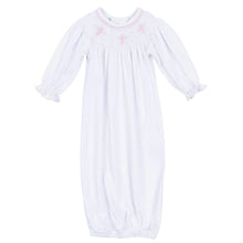 Load image into Gallery viewer, Graceful and timeless, the Forever Blessed Bishop Gown is a beautiful choice for life’s most meaningful moments. Designed with classic bishop-style smocking around the neckline, it features delicate hand-smocked cross motifs in soft pink, adding a sweet and sentimental touch.