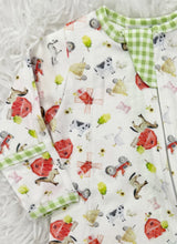 Load image into Gallery viewer, Wrap your little one in comfort and charm with the Barnyard Babies Zipper Footie from Magnolia Baby. Made from soft, breathable pima cotton, these footies provide gentle warmth and cozy softness for delicate skin. The playful farm animal and barn print adds a sweet touch, making it a delightful choice for your precious baby. Easy to put on and take off with the handy zipper, this footie combines practicality with adorable style to keep your smallest love snug all day and night.