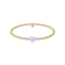 Load image into Gallery viewer, The Opal Heart Bracelet — in Hot Pink is your everyday essential with a personalized touch. Designed to layer effortlessly or stand on its own, this beaded bracelet brings a soft pop of color and natural iridescence to your stack.
Crafted with radiant 3mm beads in 14k gold-filled
Features genuine opal accents adding subtle dimension and glow
Hand-beaded on high-performance stretch cord — easy to roll on and off while maintaining its shape
Sizing:
6.5" – petite / snug fit