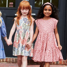 Load image into Gallery viewer, The Girls Peachy Dress in Pink Tiny Roses is a charming choice for fall occasions. Adorned with delicate pink roses and featuring a tiered skirt, this dress combines timeless style with playful elegance. Perfect for making your little girl stand out at any event, it offers both comfort and classic beauty.