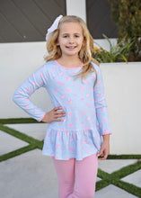 Load image into Gallery viewer, Get your little one ready to cheer in style with the Peggy Peplum Legging Set - Game On Knit by James & Lottie. Featuring a playful football print and matching leggings, this set combines comfort and spirited fun, perfect for showing team pride all season long. Designed for active girls who love to move, it’s an easy way to keep her cozy and stylish during game day or playtime.