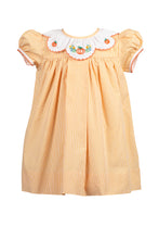 Load image into Gallery viewer, Celebrate the season in the Luciana Loop Pumpkin Dress by The Proper Peony. This charming gingham orange and white dress features a delicate scalloped collar with hand-embroidered pumpkin details, adding a touch of whimsy to your child's fall wardrobe. Perfect for autumn gatherings, its simple yet elegant design ensures your little one looks festive and stylish with ease.