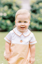 Load image into Gallery viewer, Dress your little one in festive charm with the Boys Pembroke Pumpkin Bubble from The Proper Peony. Featuring vibrant orange and white stripes, a crisp white peter pan collar, and a delicate embroidered pumpkin detail, this outfit combines playful style with seasonal spirit. Perfect for autumn celebrations, it offers both comfort and adorable appeal that will make your child stand out.