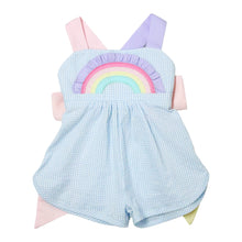 Load image into Gallery viewer, Introduce your little one to a world full of color and fun with our Rainbow Sussie Overall! Part of our adorable Rainbow Skye Dress collection, this overall features charming rainbow appliques on the pockets, a comfortable mini seersucker material, and a colorful crossback and bow design. Perfect for infant and young toddler girls who love to play and look stylish at the same time. Order now and let the adventures begin!