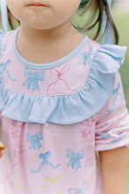 Load image into Gallery viewer, Dress your little one in the Ribbon Party Bubble from The Proper Peony, designed for both comfort and charm. Its soft knit fabric ensures ease of movement and cozy wear, while the playful bow pattern and ruffle bib collar add a sweet, elegant touch. Perfect for special occasions or everyday fun, this pink bubble combines style and softness to keep your toddler happy and looking adorable.