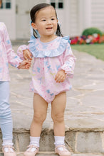 Load image into Gallery viewer, Dress your little one in the Ribbon Party Long Sleeve Dress from The Proper Peony, designed for both comfort and charm. Its soft knit fabric ensures ease of movement and cozy wear, while the playful bow pattern and ruffle bib collar add a sweet, elegant touch. Perfect for special occasions or everyday fun, this pink dress combines style and softness to keep your toddler happy and looking adorable.