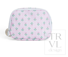 Load image into Gallery viewer, The Petite Fleur Crossbody Bag from TRVL Design is a versatile essential for little ones on the move. Featuring a front pocket and rear pocket for organized storage, plus an adjustable strap that grows with your child, this bag combines practical design with everyday style. The wipeable material makes cleanup effortless—perfect for active days and messy moments. Pair it with any outfit for a polished, functional accessory that keeps up with childhood adventures.