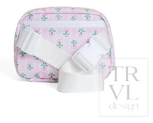 Load image into Gallery viewer, The Petite Fleur Crossbody Bag from TRVL Design is a versatile essential for little ones on the move. Featuring a front pocket and rear pocket for organized storage, plus an adjustable strap that grows with your child, this bag combines practical design with everyday style. The wipeable material makes cleanup effortless—perfect for active days and messy moments. Pair it with any outfit for a polished, functional accessory that keeps up with childhood adventures.