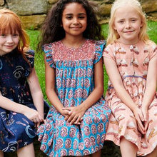 Load image into Gallery viewer, The Girls Fiona Dress in Blue Paisley Sparkle offers a captivating blend of vibrant paisley patterns and subtle sparkle, perfect for making your little girl stand out. Designed for comfort and style, this dress allows easy movement while adding a touch of magic to any occasion. Whether for celebrations or everyday adventures, it’s a charming choice that brings elegance and playful shine to her wardrobe.