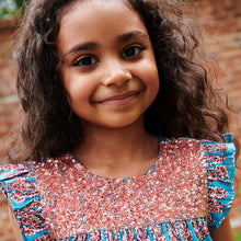 Load image into Gallery viewer, The Girls Fiona Dress in Blue Paisley Sparkle offers a captivating blend of vibrant paisley patterns and subtle sparkle, perfect for making your little girl stand out. Designed for comfort and style, this dress allows easy movement while adding a touch of magic to any occasion. Whether for celebrations or everyday adventures, it’s a charming choice that brings elegance and playful shine to her wardrobe.