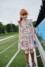Load image into Gallery viewer, The Girls Stevie Dress in Colored Pencils by Pink Chicken combines playful style with comfort. Featuring a charming smocked bodice and flutter sleeves, this dress showcases a delightful colored pencil print that sparks creativity. Perfect for back-to-school, it offers a cute and comfortable option your little girl will love to wear every day.