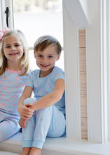 Load image into Gallery viewer, Get your little champion ready for bedtime with the Boys Game On Knit Two Piece Pajama Set from James & Lottie. Featuring a soft blue fabric adorned with playful football prints, this cozy set ensures comfort and style all night long. Perfect for active boys who love sports, these pajamas make winding down feel like scoring a touchdown.