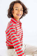 Load image into Gallery viewer, Prim &; Proper Polo in holiday stripes is the perfect holiday look to take him from Christmas photos to school events to Christmas dinner. The crisp Richmond Red and Kiawah Kelly Green stripe brings festive cheer to every occasion. Soft, breathable fabric keeps him comfortable whether he's posing for the camera or playing with family. A timeless piece that transitions seamlessly through the season.
