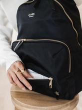 Load image into Gallery viewer, Everyone needs a trusty, everyday bag, and the Everyday Backpack from JuJuBe is here to be just that
Machine washable
11 pockets, including 2 insulated bottle pockets
Travel made easy with a trolley sleeve and removable stroller straps
Comfortable, adjustable shoulder straps
Removable stroller straps
Cushioned changing pad