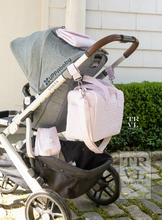 Load image into Gallery viewer, Fit all of your essentials with ease when you carry this perfectly designed Stroller Bag that can be worn as a tote, crossbody, or it can be Velcro onto your stroller.  Crafted in a water repellant material, this versatile bag features enough space to hold bottles, blankets, and toys for you and your baby. Built with interior pockets to hold essentials, 2 exterior side slip pockets for bottles, removable straps and is machine washable.