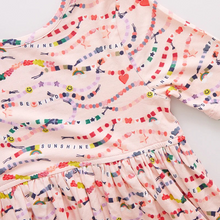 Load image into Gallery viewer, In our Friendship Bracelet Era! This exclusive new print from Pink Chicken, inspired by your favorite superstar, is a must-have for your stylish kiddos. This nostalgic print highlights positive messaging such as kindness, happiness and friendship - and is the perfect dress for class, a playdate, but most of all, your next concert. The classic Steph Dress silhouette is loved for its super swingy fully gathered skirt and skinny sleeve that hits right above the elbow. The soft and silky bamboo fabric is best k