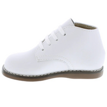 Load image into Gallery viewer, Classic high-top leather bootie featuring lace closure. Offered in matte and pearlized colors; sizes ranging from 2.0 infant - 7.0 toddler.
Custom Fit System – Removable, dual insoles in Medium and Wide provided for customized fitting.
Roomy Toe Box – Allows tiny toes room to breathe and splay naturally during walking, enhancing balance and reducing rubbing, friction, and moisture.
Arch Support – Shoe last and insole designed to provide proper arch support for developing feet.
High-quarter design provides m