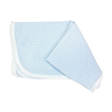 Load image into Gallery viewer, Wrap your newborn in timeless elegance with this Pom Pom Trim Receiving Blanket by Paty. Crafted from soft classic knit fabric, this essential baby blanket features delicate white mini pom pom trim that adds a touch of charm to nursery moments. Available in pink or blue, it's the perfect blend of practicality and style. Ideal for swaddling, stroller outings, or photo sessions, this blanket transforms everyday baby care into something beautifully memorable. A sophisticated choice for new parents who apprecia