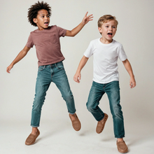 Load image into Gallery viewer, Introducing Floafers: the coolest, comfiest shoes for kids that also help save the planet! Say goodbye to boring old shoes and hello to Floafers, where style meets sustainability in every step.
Made from special environmentally friendly foam, Floafers are super light, waterproof, and keep your feet fresh all day long. The tough rubber soles mean you can play anywhere without slipping, even in the rain!
But wait, there's more! Floafers have special holes that let your feet breathe and let water and dirt