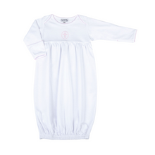 Load image into Gallery viewer, Welcome your little bundle of joy into the world with our Blessed Pink Smocked Gown. Crafted from the softest materials, this gown features a delicate cross stitched in the center of the chest and intricate embroidery on the neckline and sleeves. This simple yet elegant design is sure to become a cherished keepsake for years to come.