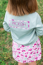 Load image into Gallery viewer, Meet the ultimate outdoor tee for adventurous girls and peace-of-mind moms! Girls' Pro Performance Long Sleeve T-shirt in Blue Surf with Pink Camo is made to move, protect, and play all day. Featuring our signature PRODOH logo with a pink camo border and "An Outdoor Tradition", this shirt adds a stylish twist to the functional favorite.