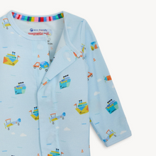 Load image into Gallery viewer, You Haul Modal Magnetic Footie from Magnetic Me transforms diaper changes into a breeze with innovative magnetic closures that open quietly and close securely—no snaps or zippers to fumble with during midnight changes. Featuring a cheerful light blue design with boats, planes, and trucks, this sustainable modal sleeper feels silky-soft against delicate skin while naturally regulating temperature for all-day comfort. 