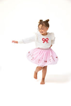 Load image into Gallery viewer, Add a touch of festive fun to your little one’s wardrobe with the Candy Canes Tutu Skirt from Angel Dear. This playful pink tutu is accented with sparkling sequined candy canes, making it perfect for holiday celebrations. Pair it with the matching Candy Canes Ruffle Shoulder French Terry Sweatshirt for an adorable, coordinated look that’s both stylish and comfortable. 