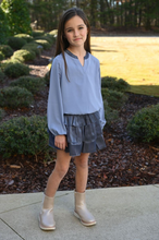 Load image into Gallery viewer, The Luna Skirt in Slate from Pleat offers a dazzling tiered design that adds sparkle to every step. Perfectly crafted for tween girls, this skirt pairs effortlessly with the Jane Textured Sweatshirt Top or Wren Top in Dashing, creating a stylish and versatile outfit. Its shimmering fabric makes it ideal for special occasions or everyday wear, giving your child a confident and playful look.