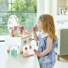 Load image into Gallery viewer, Spark creativity and boost confidence with My Stylish Dressing Table. This elegant set features bright lights, a clear mirror, and a functional hairdryer, making playtime feel truly magical. Children can practice makeup and grooming using realistic accessories, enhancing fine motor skills while inviting imaginative role play. Two spacious drawers keep all makeup pieces organized, encouraging tidiness along with fun. Perfect for little ones eager to explore self-expression in a stylish, interactive way. Age3