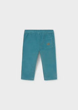 Load image into Gallery viewer, Soft corduroy infant pants in a rich teal tone, crafted with a cozy striped jersey lining for all-day comfort. The fabric make these an everyday essential that pairs beautifully with the Mayoral Bear Sweater for a coordinated look. Perfect for layering through seasons, these pants bring texture and warmth to your little one's wardrobe.