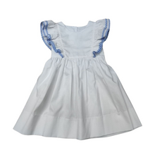 Load image into Gallery viewer, Tie back fun and fashion with Delaney's White Pique Apron Ruffle Dress for toddler girls. Featuring adorable ruffles and charming blue check details, this dress is perfect for adding a personalized touch with a monogram. Make your little one stand out in style and grab the matching girl's infant bubble for a sibling match!